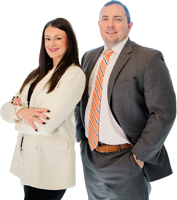 Chris Kinon and Caroline Barker standing together in professional attire, smiling confidently