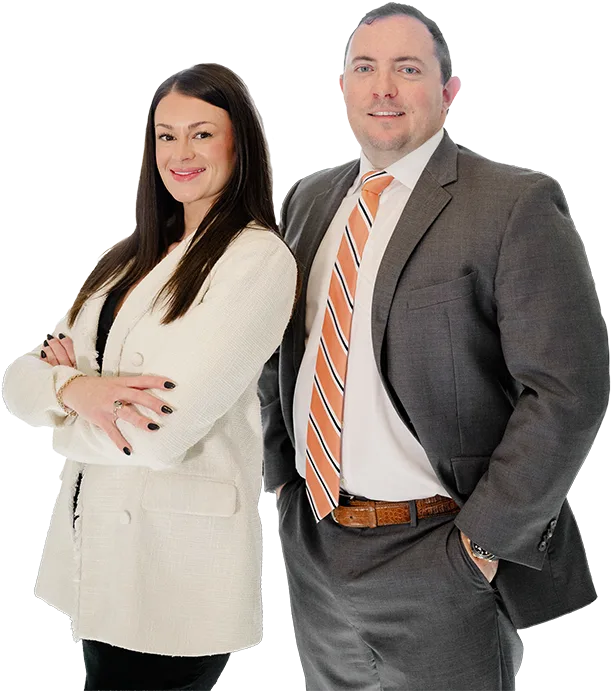 Chris Kinon and Caroline Barker standing together in professional attire, smiling confidently