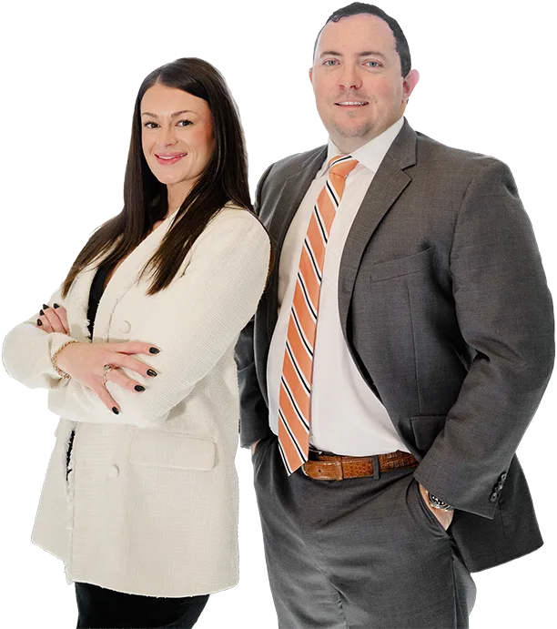 Chris Kinon and Caroline Barker standing together in professional attire, smiling confidently