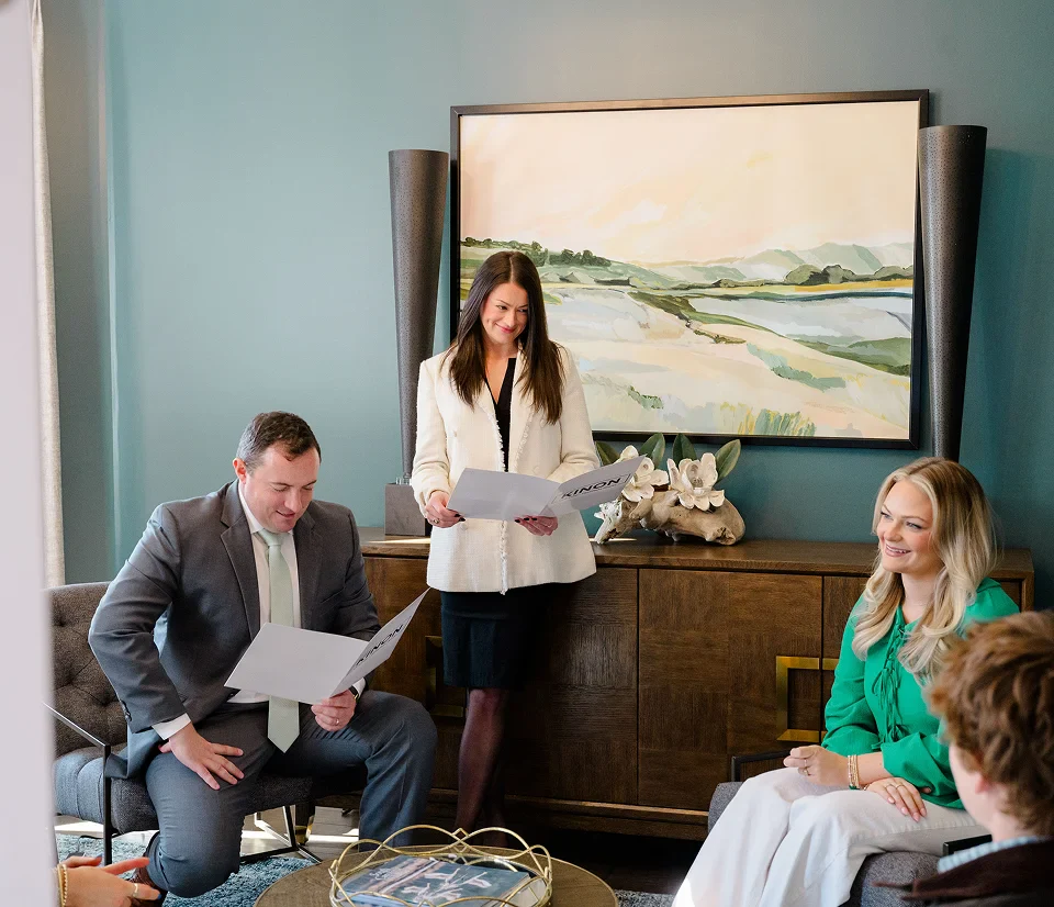 Chris Kinon and team reviewing legal documents at Kinon Law office