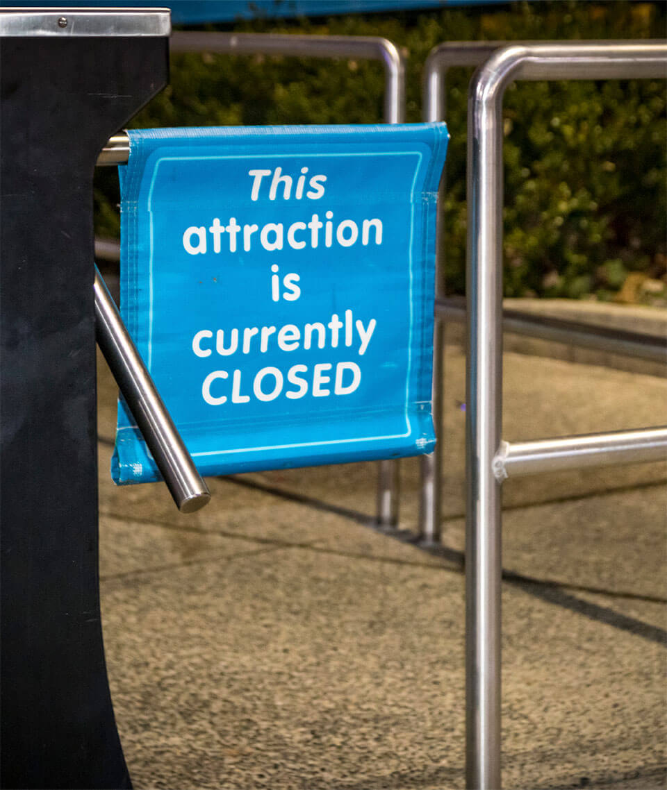 Sign that reads "This attraction is currently CLOSED"